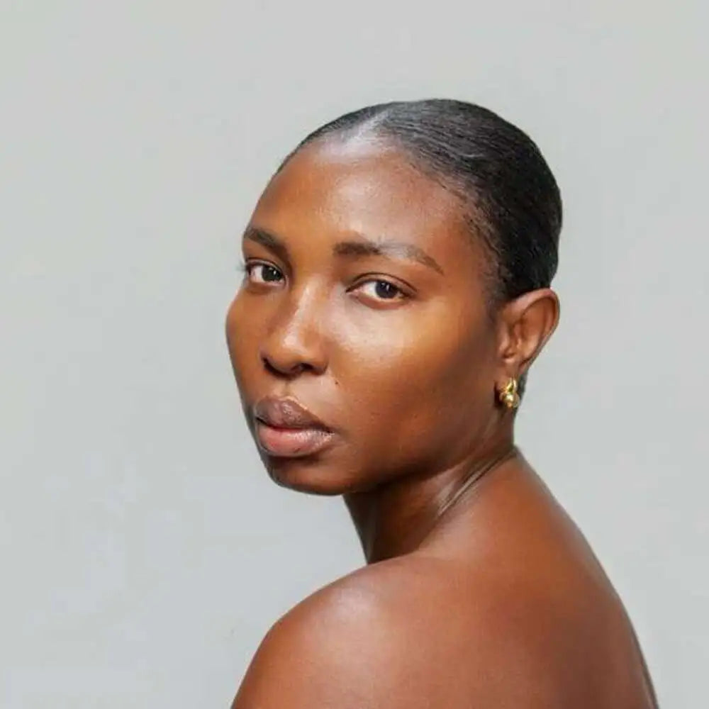 Woman with a short haircut against a plain background
