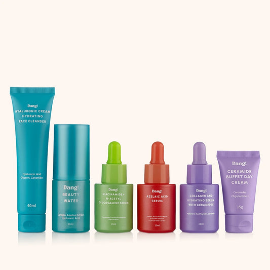Set of skincare products including face cleanser, toner, serum, and face cream on a white background