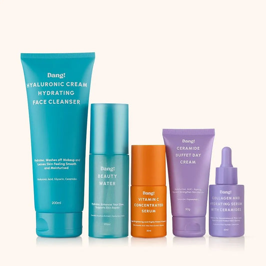 Set of Dang skincare products for skin repair including serum, toner, serum, and day cream on a white background