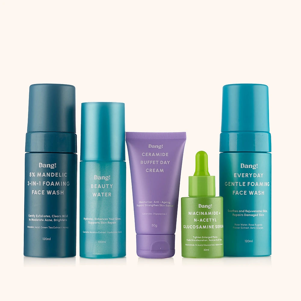 Different bottles of skincare products for beginners with different colours against a white background
